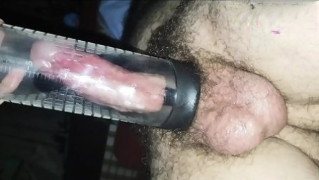 Tonight I premiere a cock pump and I make her sprinkle her cum with my oiled hand